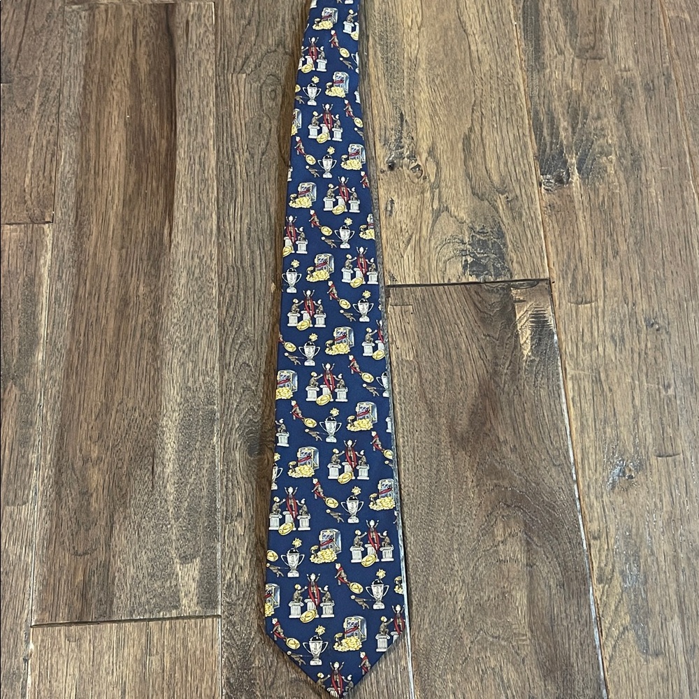 Whimsical Blue Tie with Trophy and Coin Design